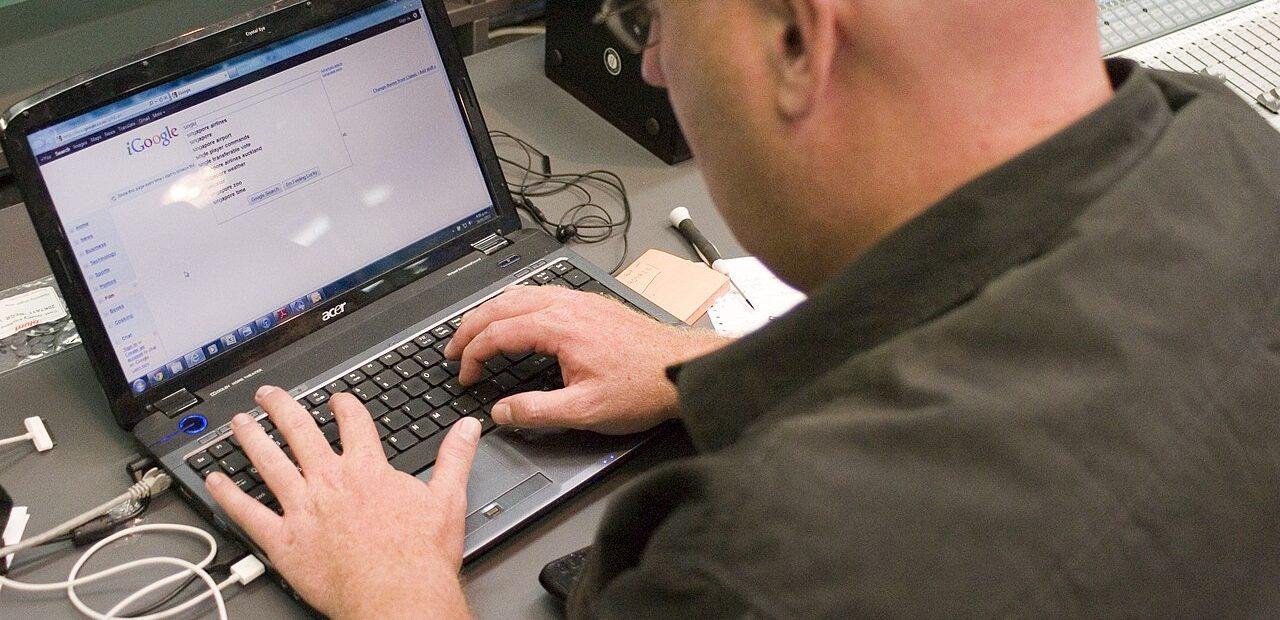 Person searching the web on a laptop