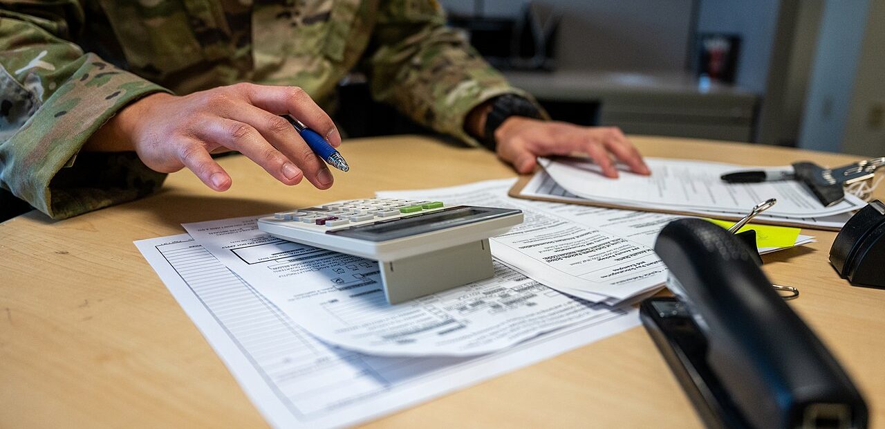 Accounting documents and a calculator on a desk